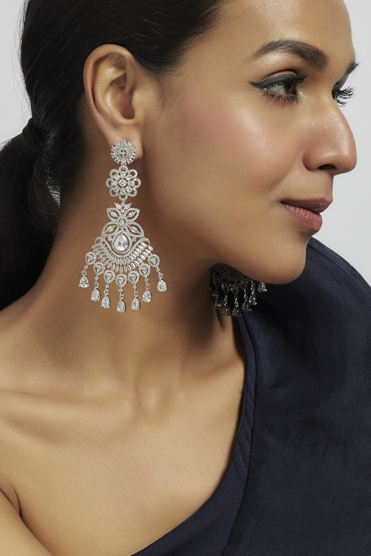 White Finish Zircon Dangler Earrings by Moh-Maya by Disha Khatri at Pernia's Pop Up Shop